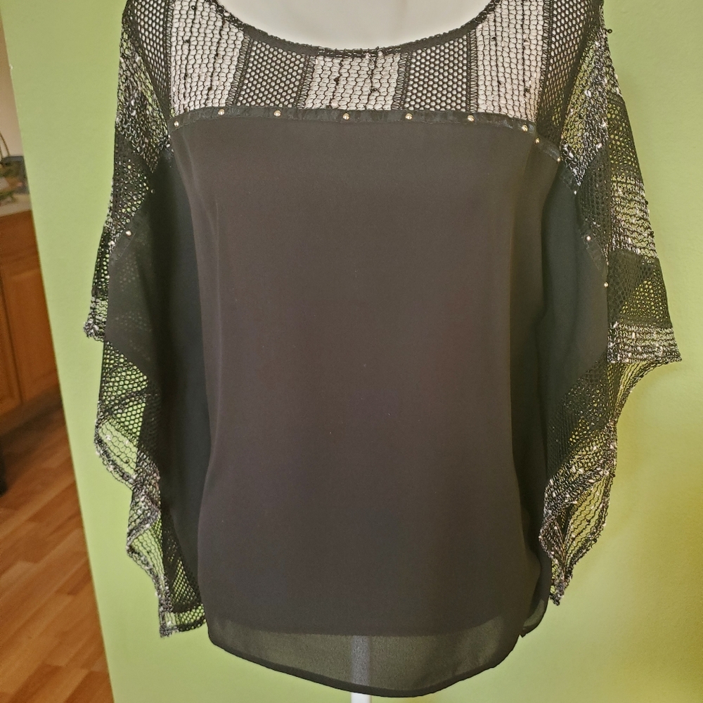 Tribal medium poncho like top.